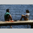 Roger Morimoto and Stephanie Ide sitting on the dock (ddr-densho-336-1543)