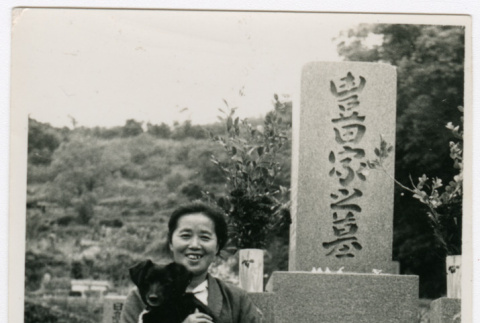 Woman stands with dog (ddr-densho-348-23)
