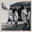 Group of girls, one holding a baby, in driveway (ddr-densho-522-89)