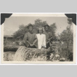 Three people wearing graduation camp and gowns (ddr-manz-10-136)
