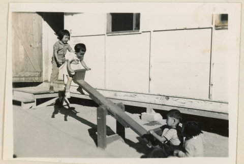 Children play on a seesaw (ddr-densho-37-981)