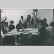 Sakura family around table at Christmas (ddr-densho-523-434)