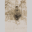 Soldier squatting in snow (ddr-janm-17-43)