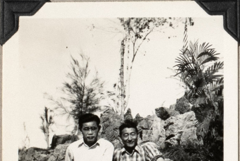 Two men sitting on rocks (ddr-densho-587-24)
