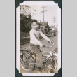 Photo of Kenji Ima on a bicycle (ddr-densho-483-1279)