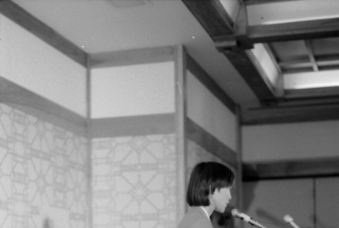 Wilma Chan speaking, Stanley Diamond at table (ddr-densho-1007-536)