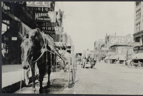 View of city street with horse (ddr-densho-355-627)