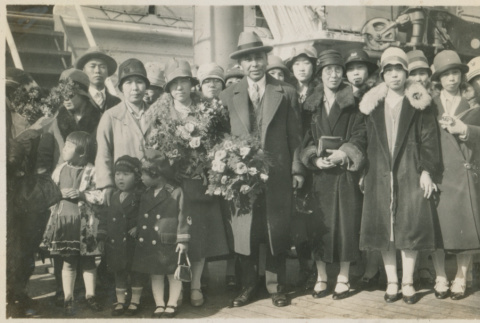 Photograph: Group in front of a ship (ddr-densho-357-265-mezzanine-4fc9a07292)