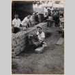 Men packing boxes  at farm in Freeport, Illinois (ddr-densho-379-698)