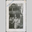 A woman in front of a house (ddr-densho-298-195)