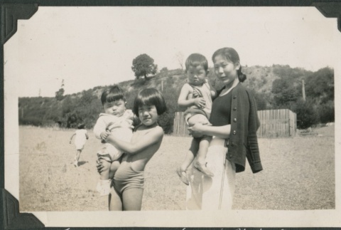 A woman with three children (ddr-densho-321-714)