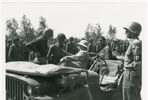 Servicepeople and military vehicle (ddr-densho-1007-169)