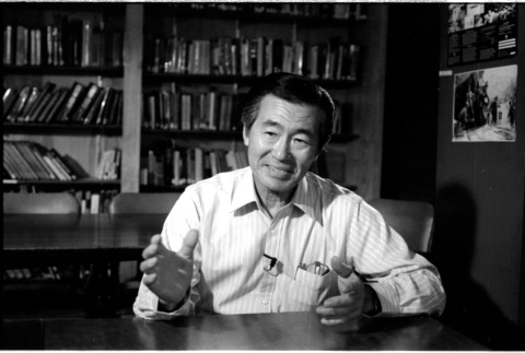 Frank S. Emi at desk (ddr-densho-1007-1153)
