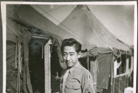 Soldier in front of tents (ddr-densho-201-485)