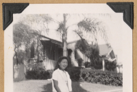 Girl on a sidewalk (ddr-densho-542-228)