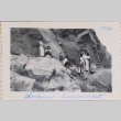 Group standing on rocky hillside (ddr-densho-464-28)