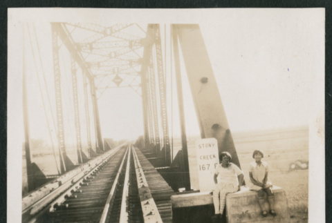 2 kids on a train bridge (ddr-densho-378-381)