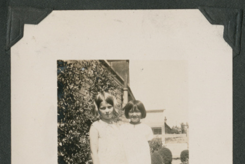 two girls outside a house (ddr-densho-378-508)