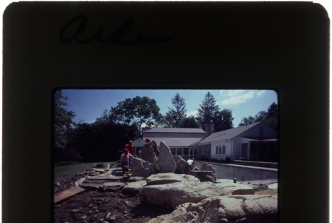 Construction on a rock garden and pool at the Arden project (ddr-densho-377-647)