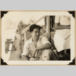 Gary Kikawa on a porch (ddr-densho-542-552)
