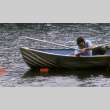 Stuart Wong trying to retrieve a bag in the water (ddr-densho-336-877)