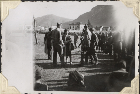 Woman talking with group of soldiers (ddr-densho-466-769)