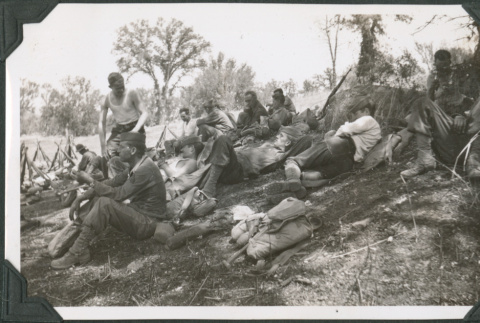 Men resting on hillside (ddr-ajah-2-184)
