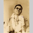 Kanichi Niisato, a blind author wearing leis (ddr-njpa-4-1399)