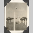Rows of crosses with flag in background (ddr-densho-466-688)