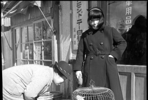 Woman and girl with bird in cage (ddr-densho-426-272)