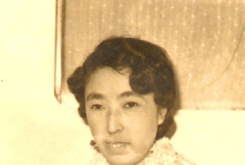 Woman wearing leis (ddr-njpa-4-2443)