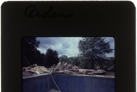Construction on a rock garden and pool at the Arden project (ddr-densho-377-651)