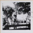 Yoshiko and Leslie Shiomi with monkey in dress (ddr-densho-522-411)