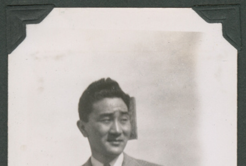 Pvt. Sam Nakagawa in a coat and tie (ddr-densho-463-27)