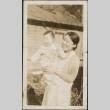 Kiku Fujii holding a baby (ddr-densho-321-666)