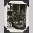 Two men sitting on amphibious vehicle (ddr-densho-466-682)