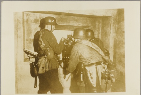 Soldiers firing through a window (ddr-njpa-13-1666)