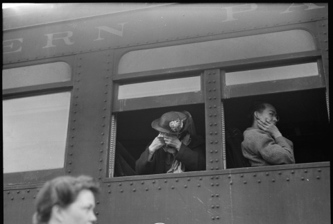 Japanese American crying as train leaves station (ddr-densho-151-302)