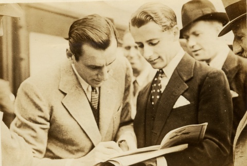 Fred Perry reading an article (ddr-njpa-1-1285)