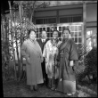Man and three women outside building (ddr-densho-426-303)