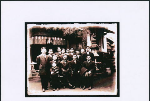 Group of 13 men and a baby outside a shrine (ddr-densho-423-455)