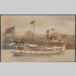 Boat with U.S. and Japanese flags (ddr-densho-355-639)