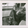 Man seated by low tables (ddr-densho-426-2461)