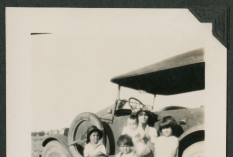 family photo in front of a car (ddr-densho-378-715)