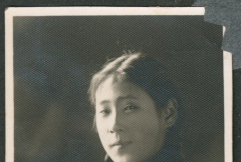 Portrait of a woman with braided pigtails (ddr-densho-483-337)