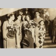 A man and woman being greeted with bouquets (ddr-njpa-1-1881)