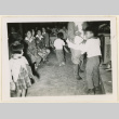 Children receive gifts from Santa Claus (ddr-densho-37-1305)
