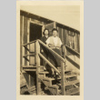 Women standing on stairs of camp barrack (ddr-csujad-37-2)