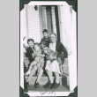 Photo of two women, two children, and a dog on a front stoop (ddr-densho-483-1350)