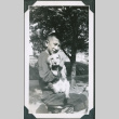 Photo of Paul Ima holding a dog (ddr-densho-483-1298)